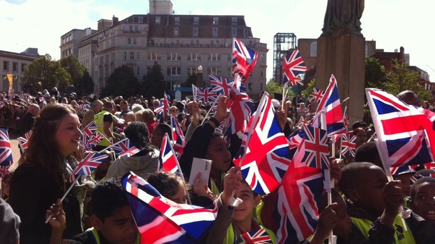 Crowds building in a sunny Victoria Square for Queen's visit