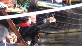 Ribbon being cut over a canal in Birmingham to mark the handover to the Canal & River Trust