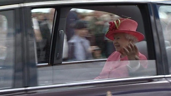 The Queen waves to crowds at RAF Cosford