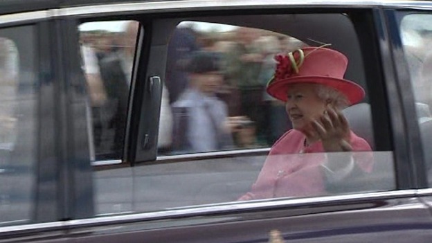The Queen waves to crowds at RAF Cosford