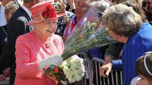 The Queen accepts some flowers