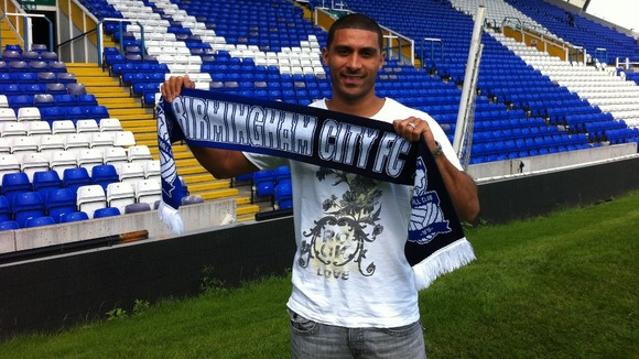 Hayden Mullins waving his Blues scarf today