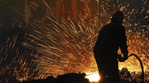 Labourers work at a steel manufacturing plant in Hefei, Anhui province.