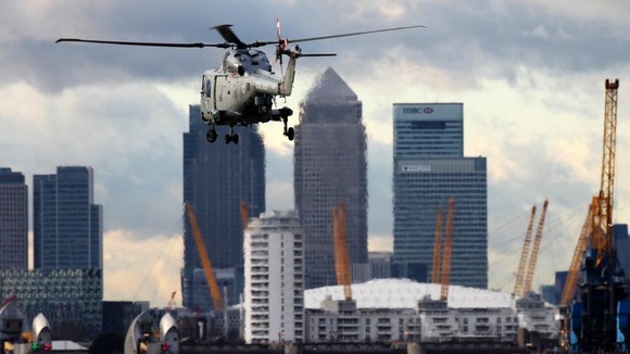 A Royal Marines helicopter hovers over the River Thames during an exercise earlier this year.