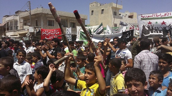 Demonstrators protest against Syria's President Bashar al-Assad after Friday Prayers in Binsh near Idlib