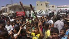 Demonstrators protest against Syria's President Bashar al-Assad after Friday Prayers in Binsh near Idlib
