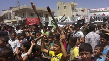 Demonstrators protest against Syria's President Bashar al-Assad after Friday Prayers in Binsh near Idlib
