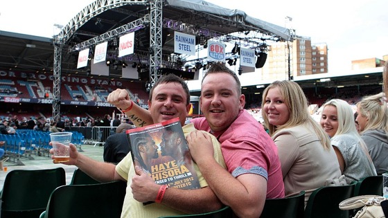 Fans wait in the crowd ahead of the David Haye and Derek Chisora fight at Upton Park, London.
