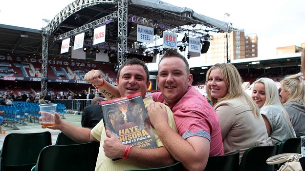 Fans wait in the crowd ahead of the David Haye and Derek Chisora fight at Upton Park, London.