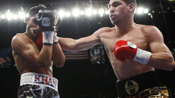 Khan takes a punch from Garcia.