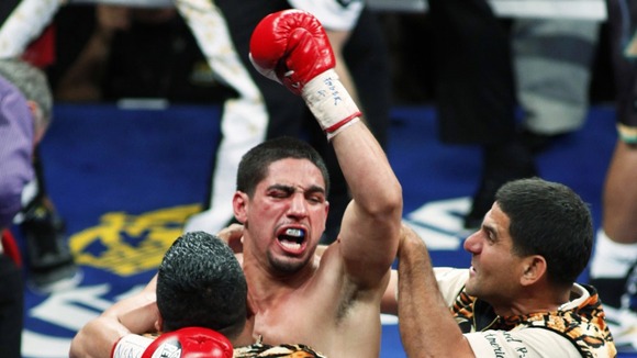 Garcia celebrates his fourth-round victory over Khan.