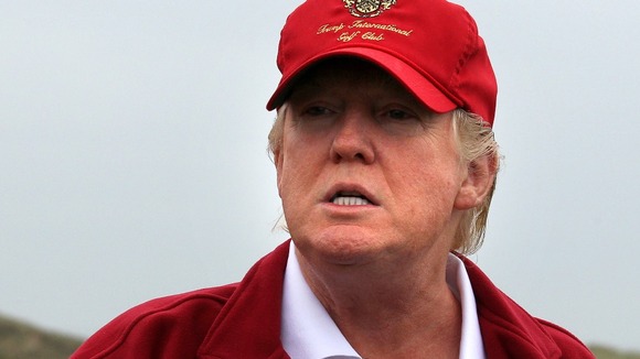 Donald Trump on the Trump International Golf Links golf course near Aberdeen after officially opening it.