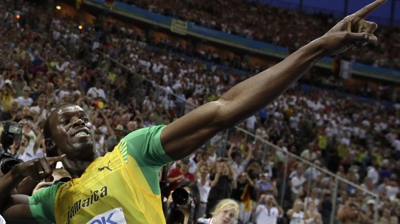 Usain Bolt does his traditional celebration