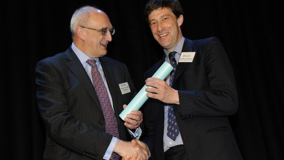 Dr Simon Learmount (right) receives his award