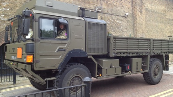The military arrive at the disused warehouse building which is currently being cleaned