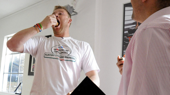 Freddie Flintoff practising eating chocolate eclairs before taking on The BT Sport Relief Challenge