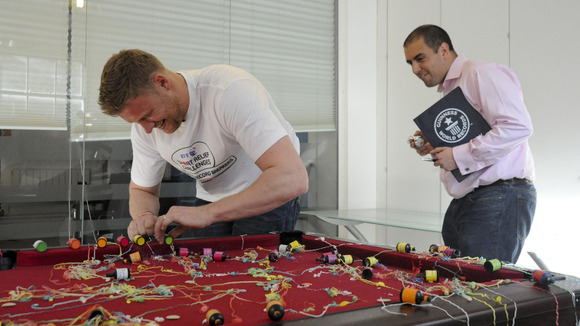 Freddie Flintoff practising popping party poppers before taking on The BT Sport Relief Challenge