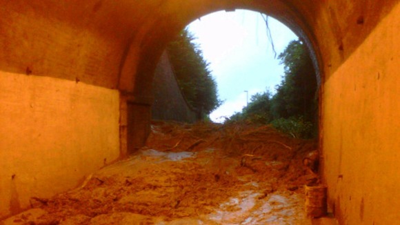A view of the tunnel shortly after the collapse, before it was realised a car lay under the mud