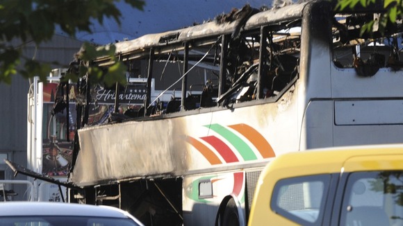 The damage to the bus shows the power of the blast.