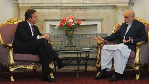 Prime Minister David Cameron meets Afghan President Hamid Karzai.