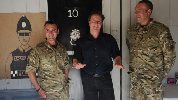 David Cameron meets British soldiers at Camp Bastion who made a mock up Number 10.