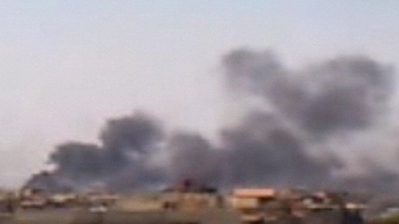 Smoke billows from the Damascus skyline in Syria.