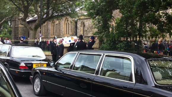 Coffin leaves churchyard