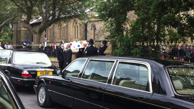 Coffin leaves churchyard