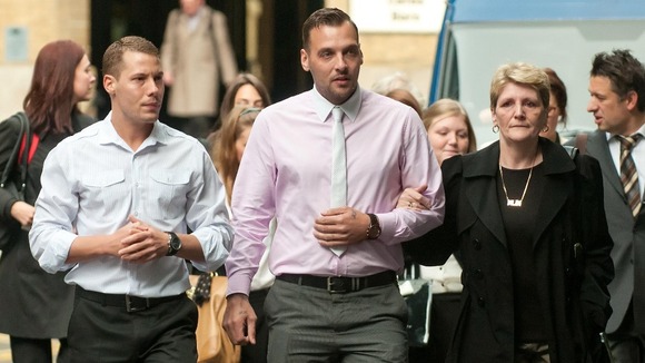 Julia Tomlinson (right) the widow of Ian Tomlinson and her sons Richard King (left) and Paul King (centre).