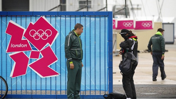A G4S employed security guard checks an athlete's accreditation at the Weymouth and Portland Sailing Academy.