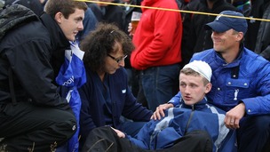 Jason Blue, aged 16, from Bristol with a bandaged head after a stray ball from Northern Ireland's Rory McIlroy hit him on the head.