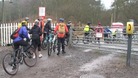 Cyclists at the Moors Gorse level crossing near Hednesford in Staffordshire
