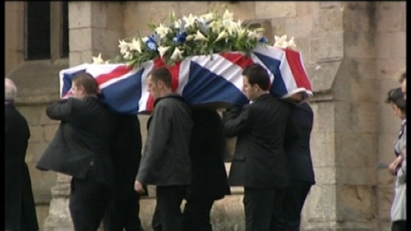 Coffin arriving at church