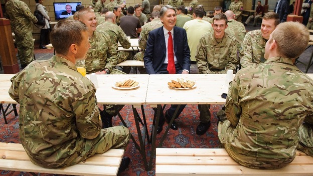 Defence Secretary Philip Hammond speaks to troops during a visit to the temporary Army barracks in east London
