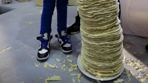 Mia Mason aged 4 helps the chefs of Poppadom Restaurant attempt to break the Guinness World Record