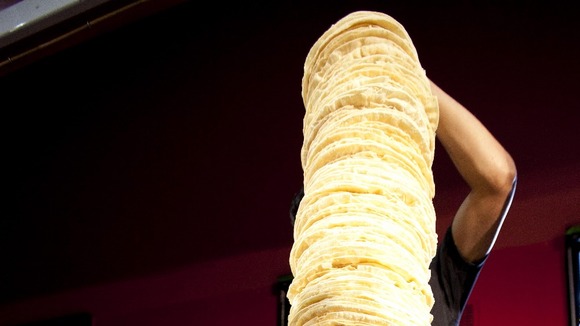 Mia Mason aged 4 helps the chefs of Poppadom Restaurant attempt to break the Guinness World Record