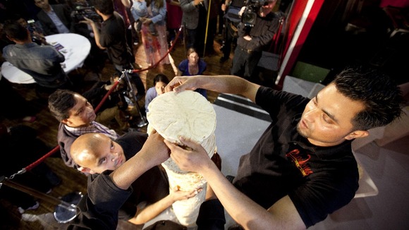 Shamin Ali and Rayman Ali from the Poppadom Restaurant attempt to break the Guinness World Record