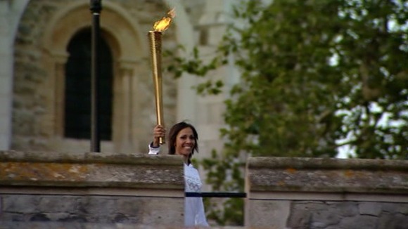 Dame Kelly Homes at Tower of London with Olympic torch