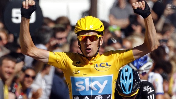 Bradley Wiggins celebrates on the finish line after the final stage of the 99th Tour de France