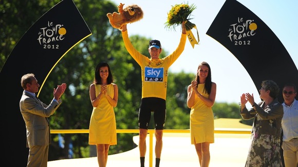 Bradley Wiggins of Sky Pro Racing celebrates on the winners podium after winning the 2012 Tour de France in Paris