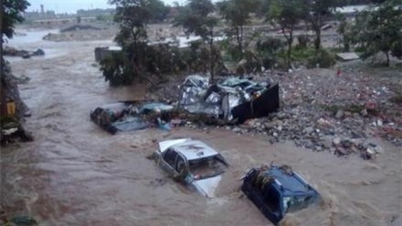 Submerged vehicles after the floods in the Fangshan district of Beijing