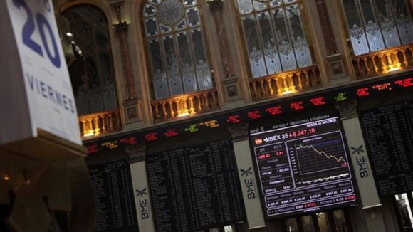 n electronic board displays how the benchmark Ibex 35 declined during trading at the Madrid bourse