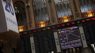 n electronic board displays how the benchmark Ibex 35 declined during trading at the Madrid bourse