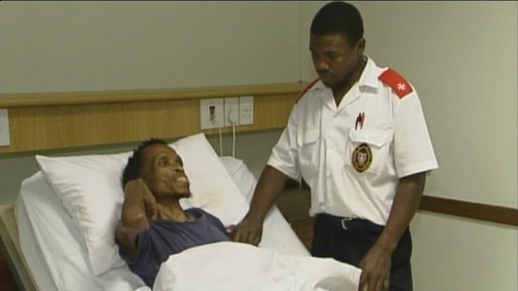 Man in hospital bed in Soweto