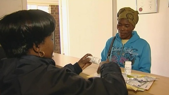 Women picks up prescription drugs from a clinic