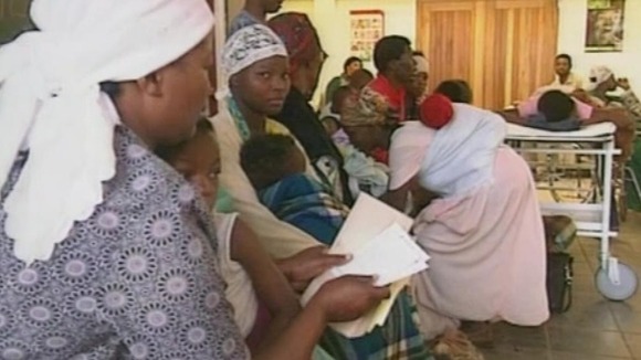 Women wait in a queue in a hospital in Soweto