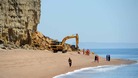 Rescue workers at the scene of the Burton Bradstock Landslide in Dorset