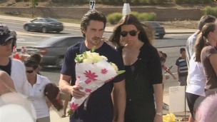 Christian Bale and his wife Sibi visit a make shift memorial to the Aurora victims.