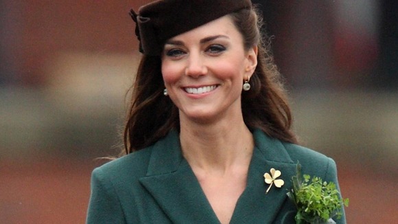 Kate wore a military style, racing green dress
