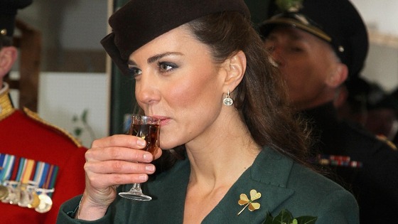 The Duchess of Cambridge holds a glass of Harvey's Bristol Creme. 